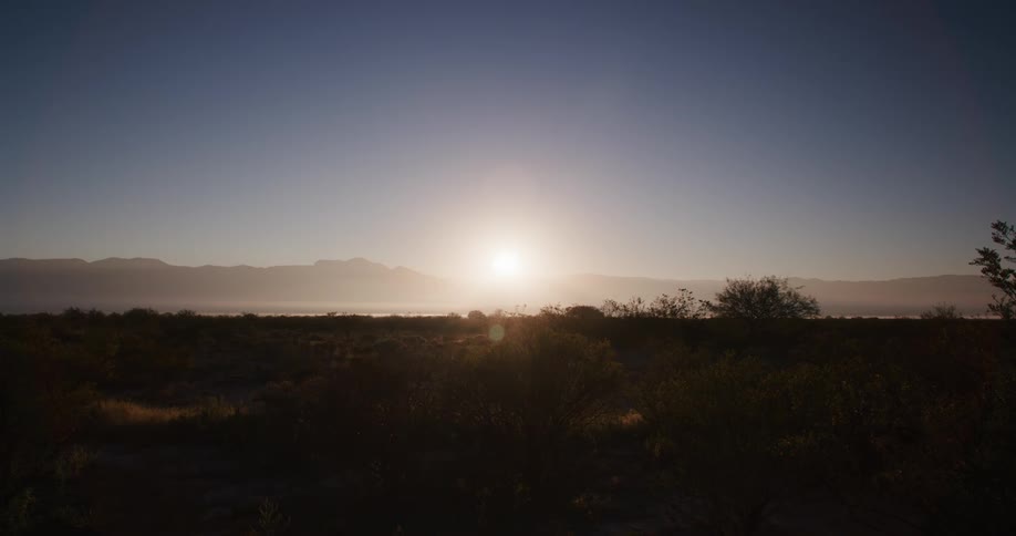 Sun setting above the landscape in spring