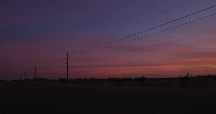 Power lines cross the desert