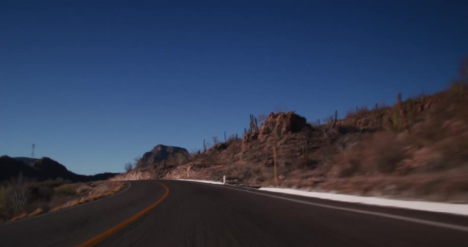 The road goes through the mountains