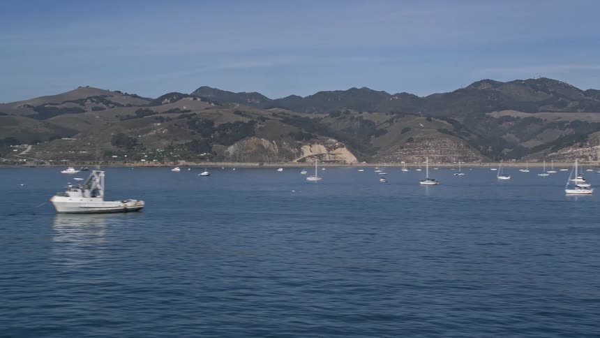 Panoramas of the bay with boats and yachts and mountains on the horizon
