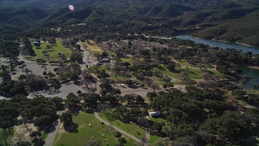 A dock near a small town surrounded by lakes