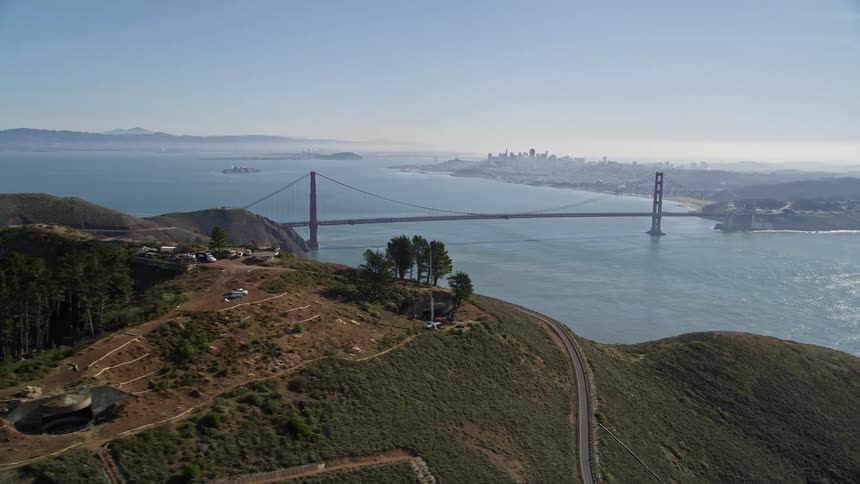 A bridge spans two land masses over the sea