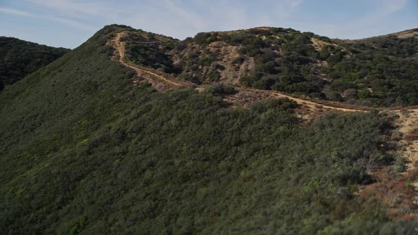 Aerial of a hiking trail along the top ridge of hills