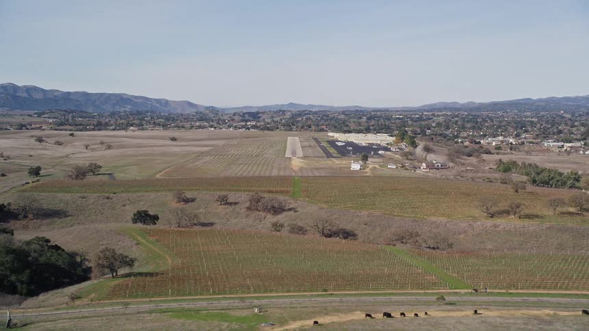 Aerial panorama of an open location with airport runway