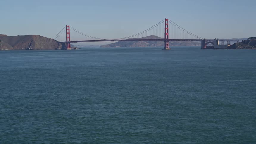Aerial panorama of the golden gate bridge over a vast blue sea