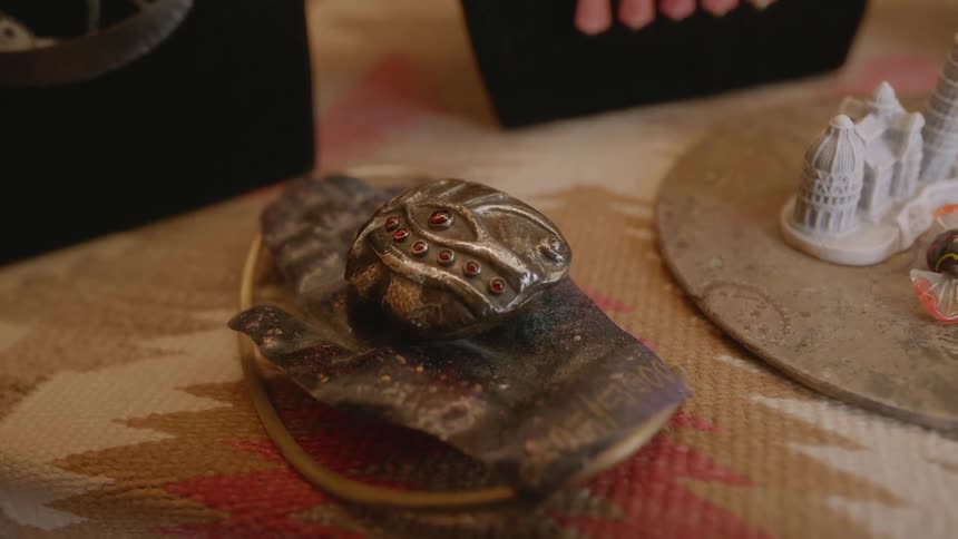 Small figurine type artwork on a table