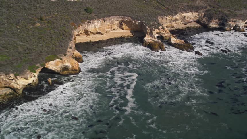 Aerial view of cliffsides along a rocky shoreline
