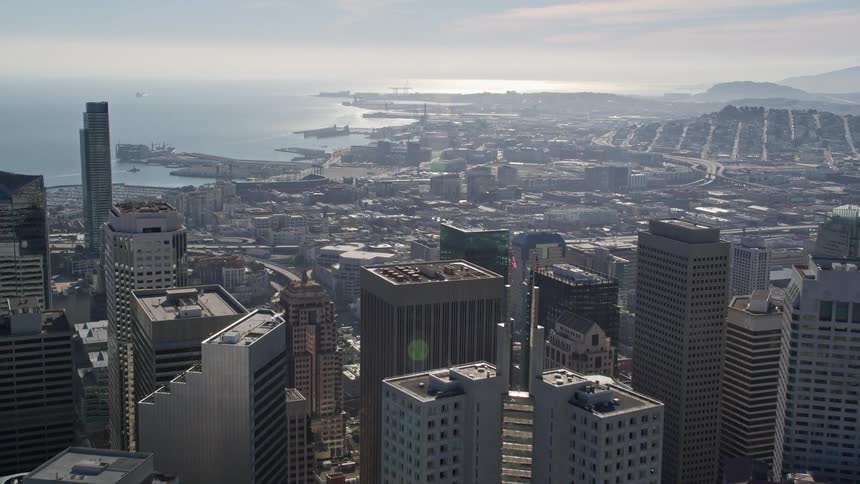 Aerial of citscape in an urban area with the ocean in the background
