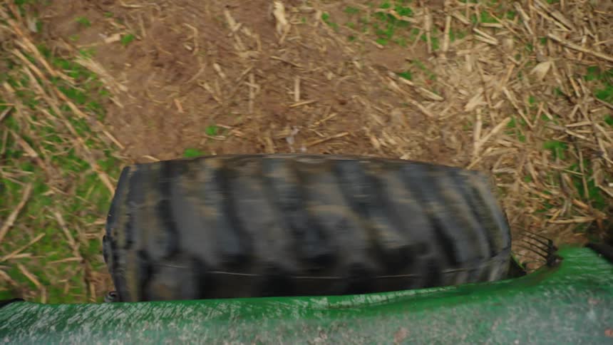 A truck is driving in the dirt