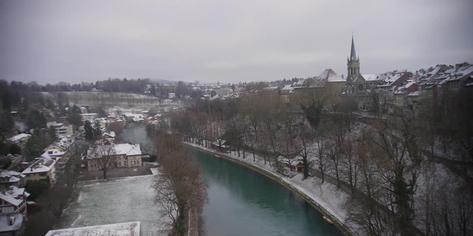 View of the Aare River winding through neighborhoods on opposite banks in Bern, Switzerland
