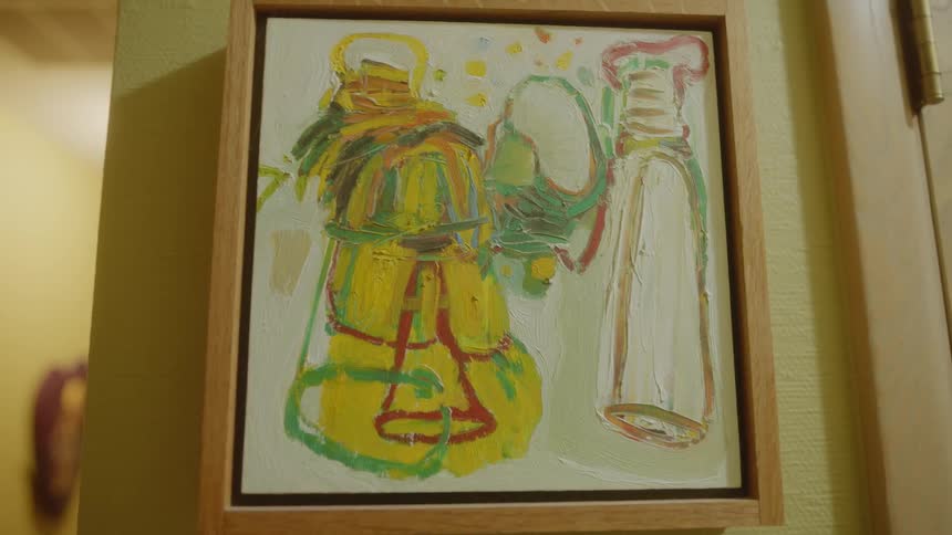 Closeup of a small artistic painting on the wall