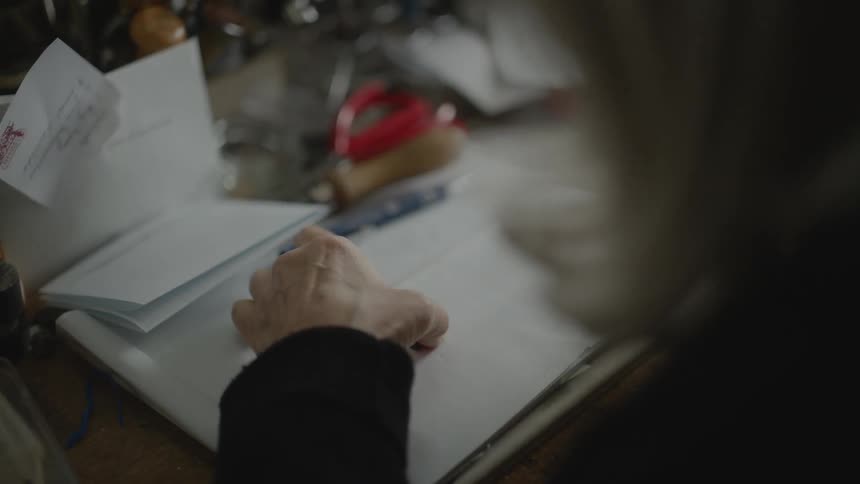 Woman hands working on a drawing