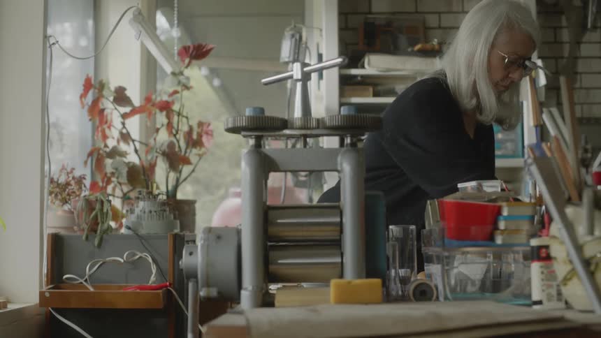 An old lady working in her store