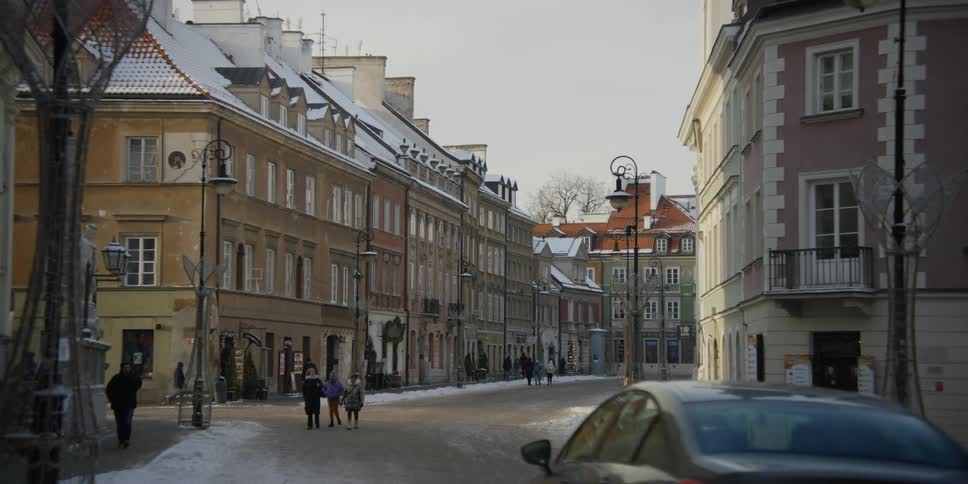 Colorful buildings and classic architecture on a city street in Old Town Warsaw, Poland