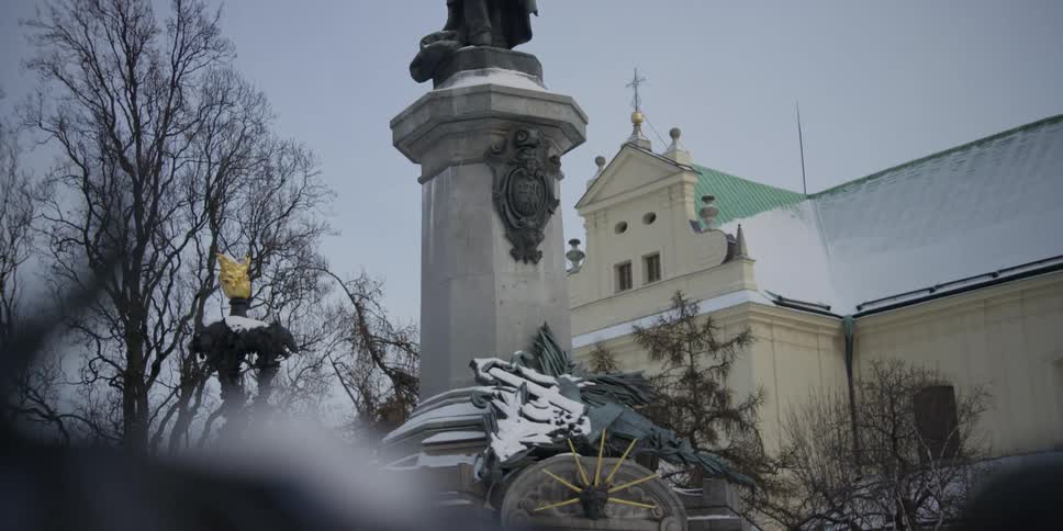 View of Adam Mickiewicz the Poet monument in front of the Carmalite Church in Warsaw, Poland