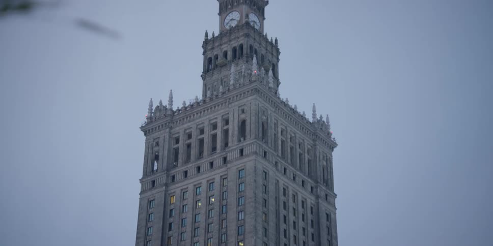 Slow upward view of the Palace of Culture and Science in Warsaw, Poland