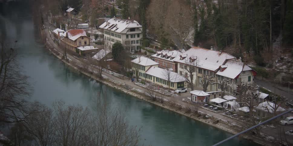 View of homes on the bank of the River Aare in snowy Bern, Switzerland
