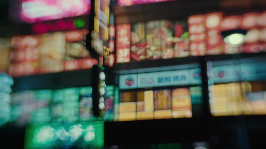 Numerous large television screens transmit images and text