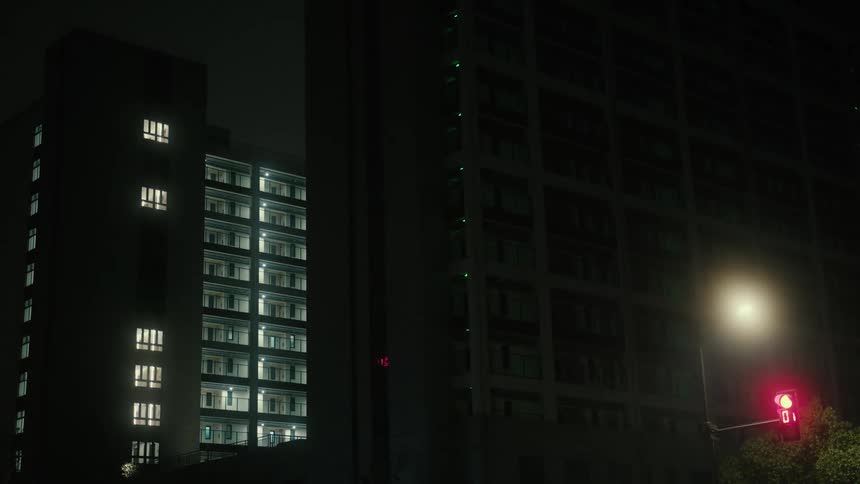 Large apartment building in the night lighting