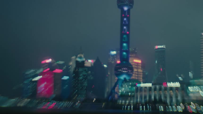 Out of focus night view of the oriental pearl tv tower in shanghai