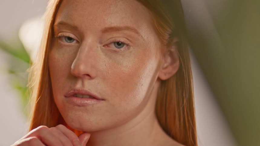 A woman is slowly blinking