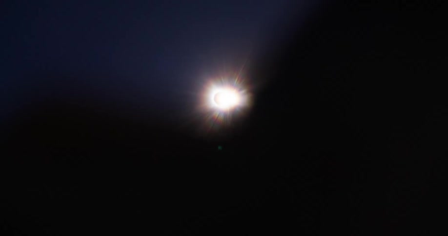 Upward view of a solar eclipse