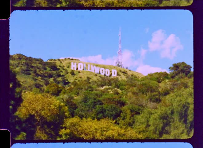 The iconic hollywood sign is prominently displayed on the side of a hill