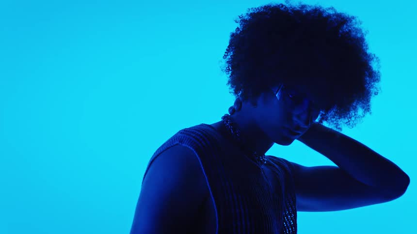 A clip of a boy on an afro hair cut in a studio