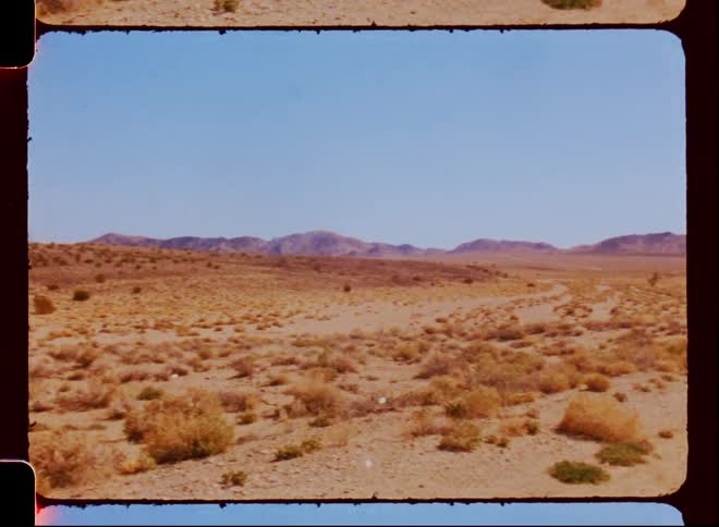 A road runs through a desert area
