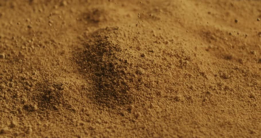 The sand explodes rising and falling
