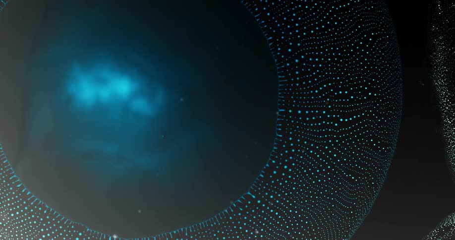 Drop of vibrant blue liquid falling and dissipating forming small abstract blue balls on a black background