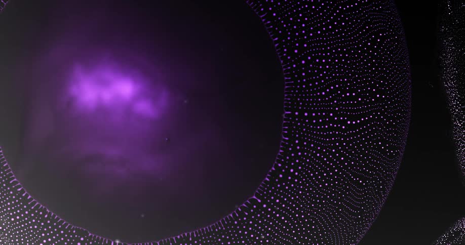Extreme closeup on a drop of purple liquid that dissipates through small abstract balls patterned on a black background