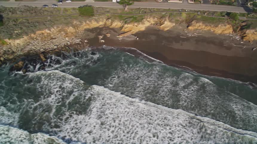 Aerial panorama of a beach on the edge of a city