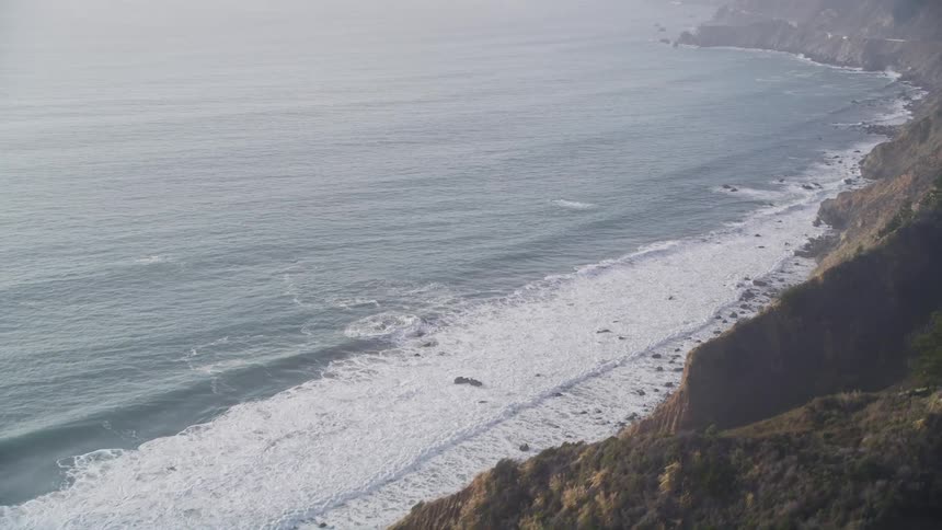 Aerial landscape of a highway on the coastal coast during the day