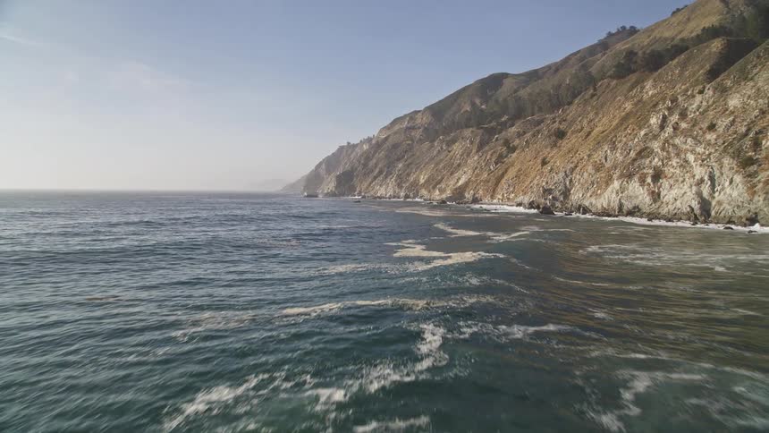 Natural sea scenery near the rocky coast during a clear day
