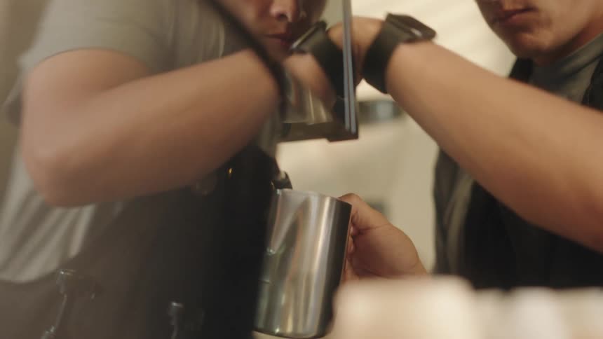Portrait of a man preparing coffee in a machine