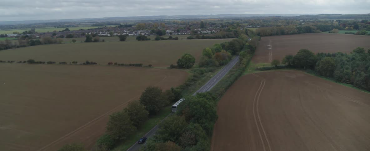 Traffic travels on the road through the landscape