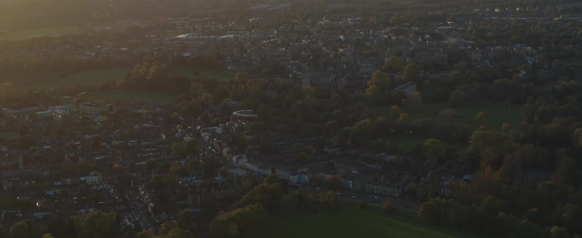 Aerial footage of a city skyline at dawn