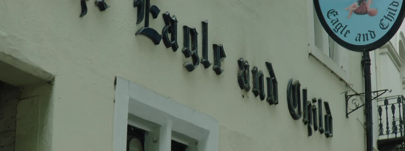 Facade of a pub with an eagle logo
