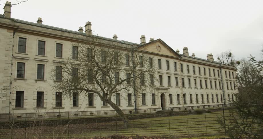 The building has many windows on the facade
