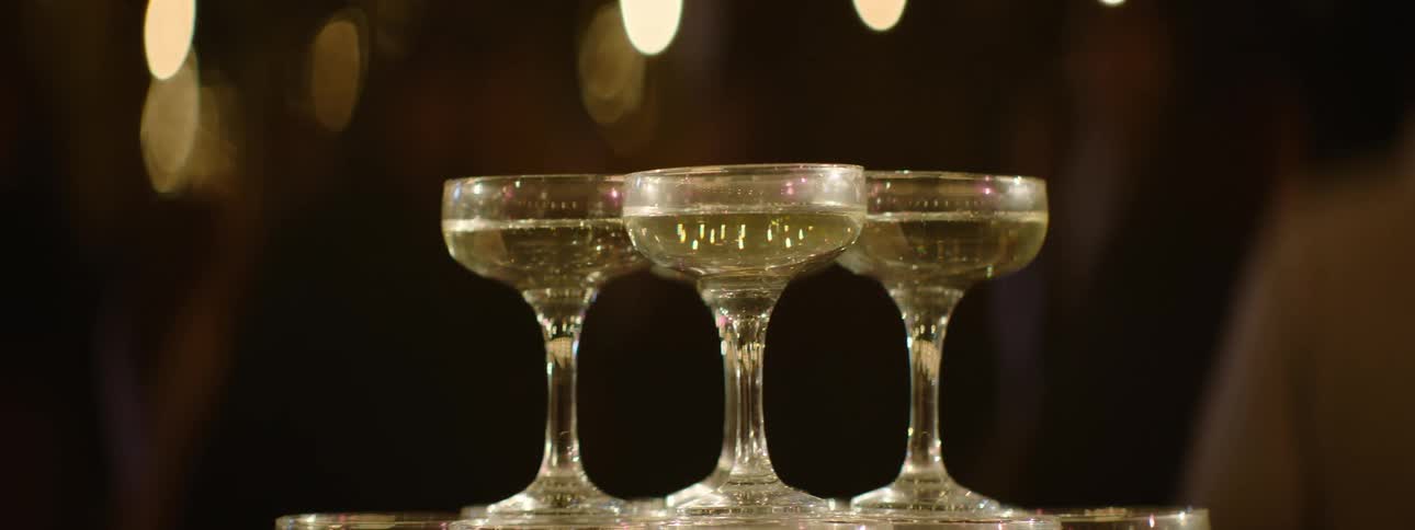 Champagne flutes stacked on top of a tower