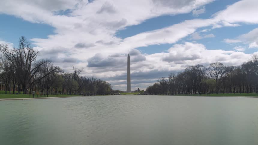 Visitors arrive at the mall near the washington monument