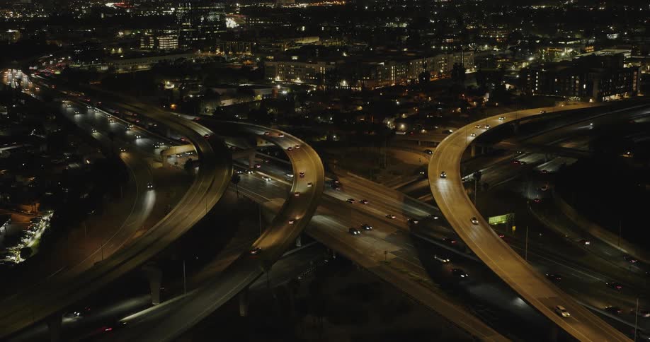 An aerial view of a busy freeway at night