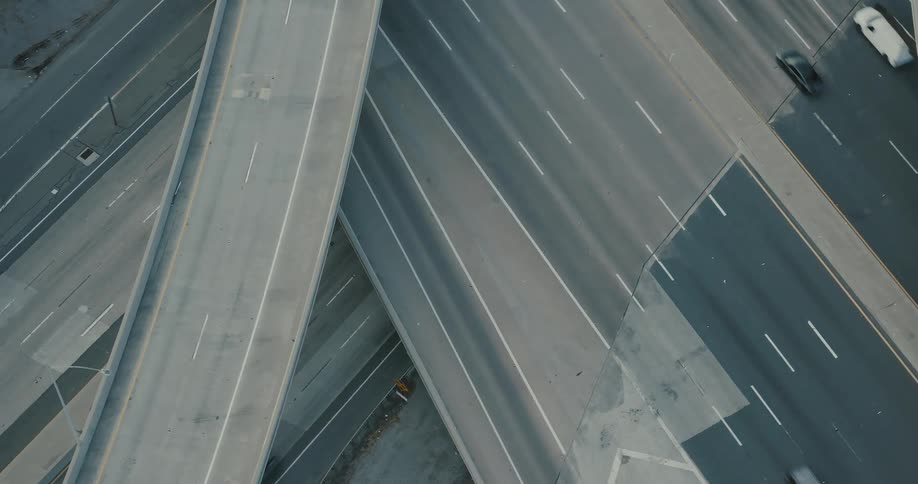 Top view of highways and overpasses with vehicle traffic during the day