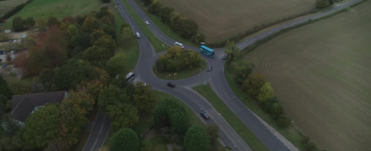 Aerial view of traffic on a roundabout in the countryside