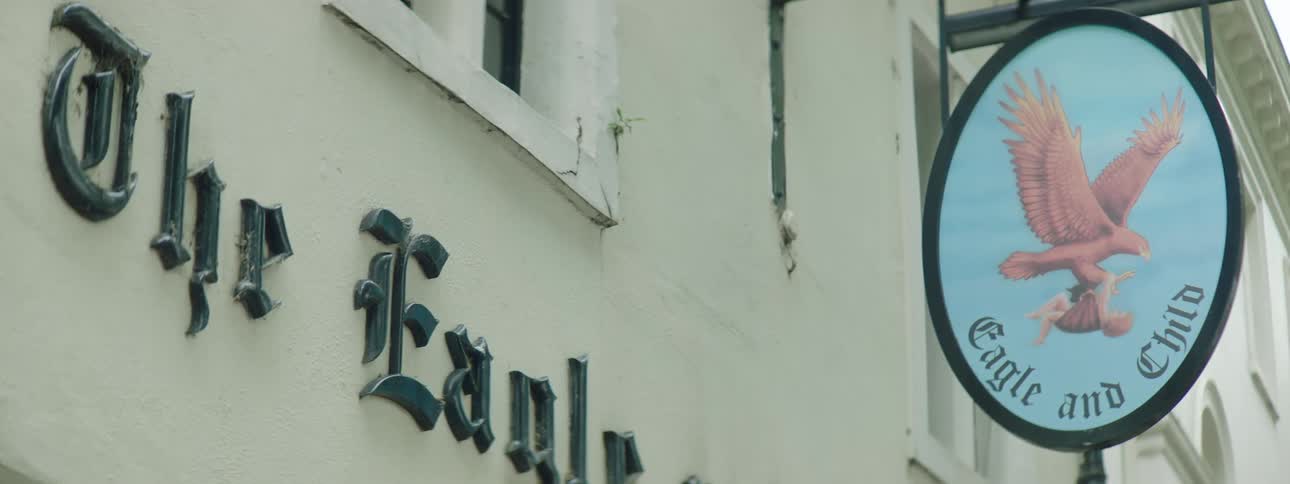 Sign with an eagle symbol in an establishment at the top and exterior
