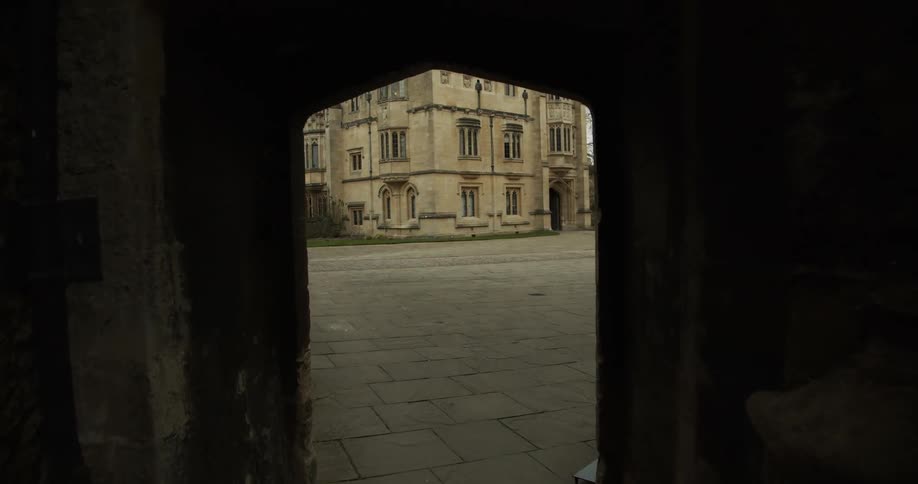 Viewpoint of a tunnel exit to a suburb with medieval and ancient buildings