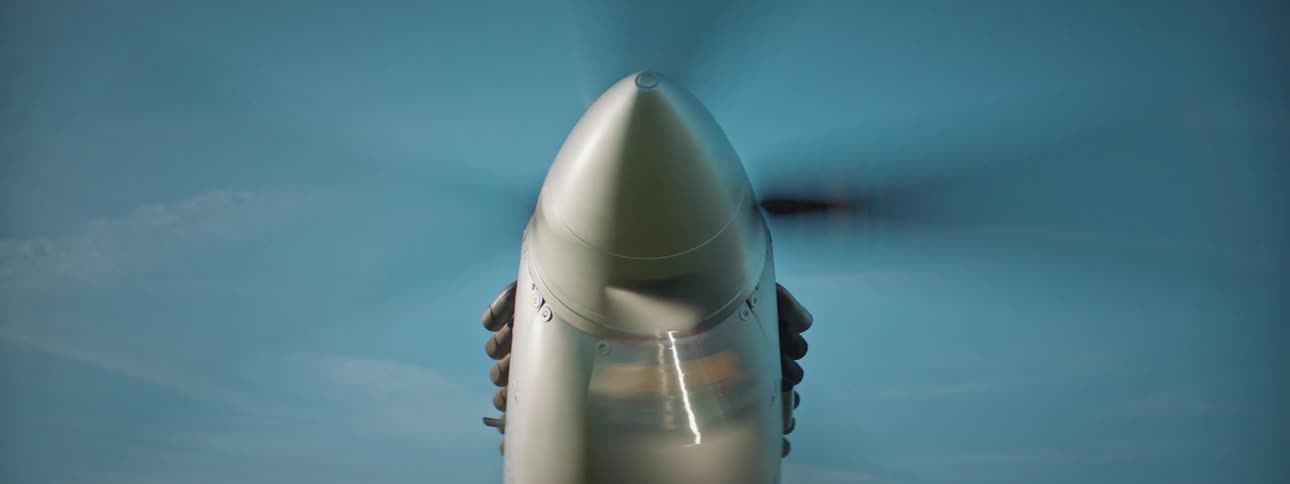 Nozzle of a singleengine plane turning on the propeller and fire coming out around it