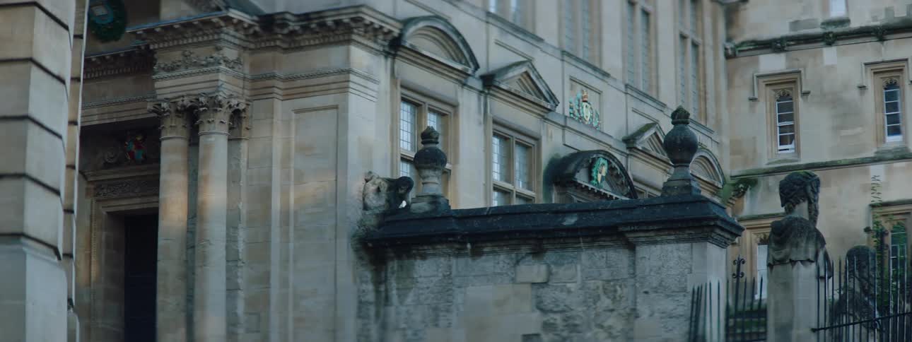 Exterior architecture of a rustic building with pillars during the day