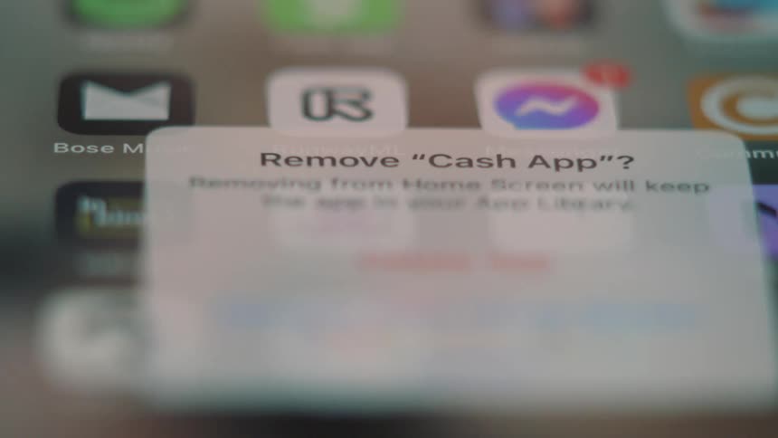 A clip of a person using a smart phone to delete an app